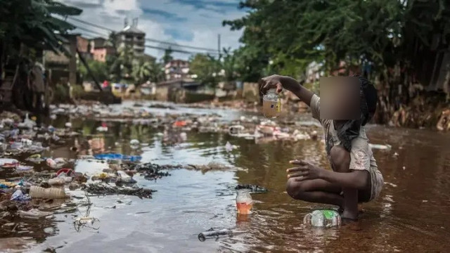 Picture of  A child playing with dirty water